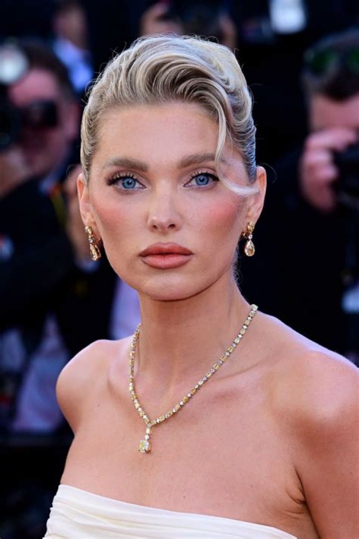 Elsa Hosk displays her very toned tummy as she models a green bikini